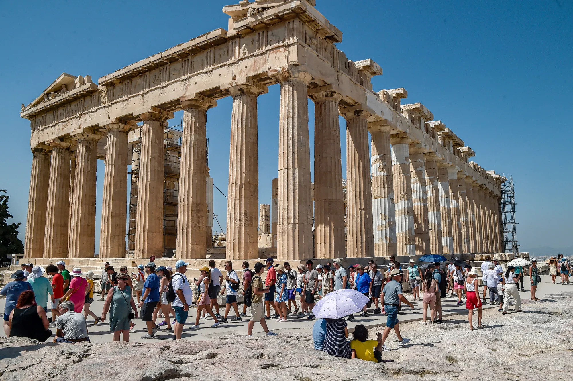 View of the Acropolis ancient hill with Parthenon temple during a heat wave, 2023, Athens, Greece.