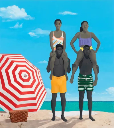 Two Black men holding two Black women on their shoulders on the beach beside a red striped umbrella.