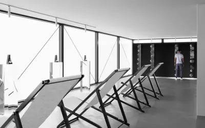 A grouping of folding chairs in a gallery.