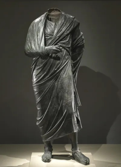 The Emperor as Philosopher, probably Marcus Aurelius (reigned AD 161-180), c. AD 180-200. The extremely high quality and monumental scale of this bronze draped figure suggest that this is an imperial portrait. The pose with left leg forward, right arm raised to the chest, and right hand visible - is identical to several Greek portraits of philosophers. The figure is most probably the Roman emperor Marcus Aurelius, who was a student of Stoicism, a set of Greek philosophical beliefs popular among educated Romans of his day. Marcus Aurelius wrote a collection of philosophical reflections called Meditations. Creator Hans Springinklee (German, 1540). (Photo by Heritage Arts/Heritage Images via Getty Images)