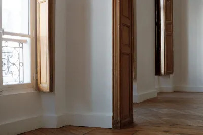 View of a historic Paris building that is empty. 