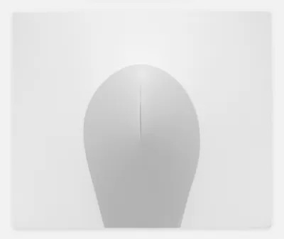 A mostly white abstract canvas with a circular grey portion that has a slit in it.