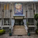 ADDIS ABABA, ETHIOPIA - FEBRUARY 14: A worker stands in front of the National Museum of Ethiopia on February 14, 2024 in central Addis Ababa, Ethiopia. More than 20 million Ethiopians are in need of food aid, according to estimates from the UN