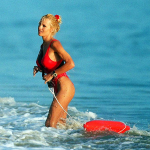 A woman in a red bikini in the sea.