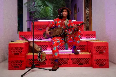 Simo Lagnawi performs on a set of red crates. 