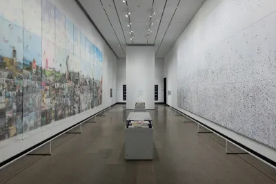 Two large-scale installation works face each other in a museum. 