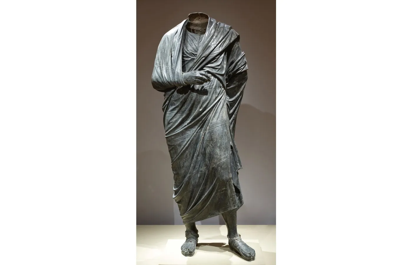 Draped Male Figure, c. 150 BCE–200 CE. Roman or possibly Greek Hellenistic. Bronze, hollow cast in several pieces and joined; overall: 193 cm (76 in.). The Cleveland Museum of Art, Leonard C. Hanna, Jr. Fund 1986.5