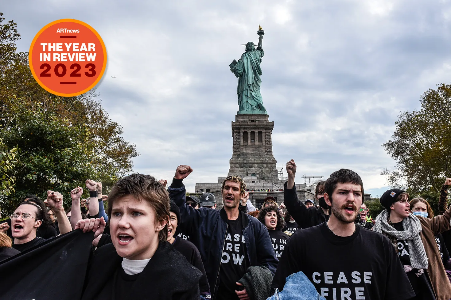 Many people in black shirts reading 