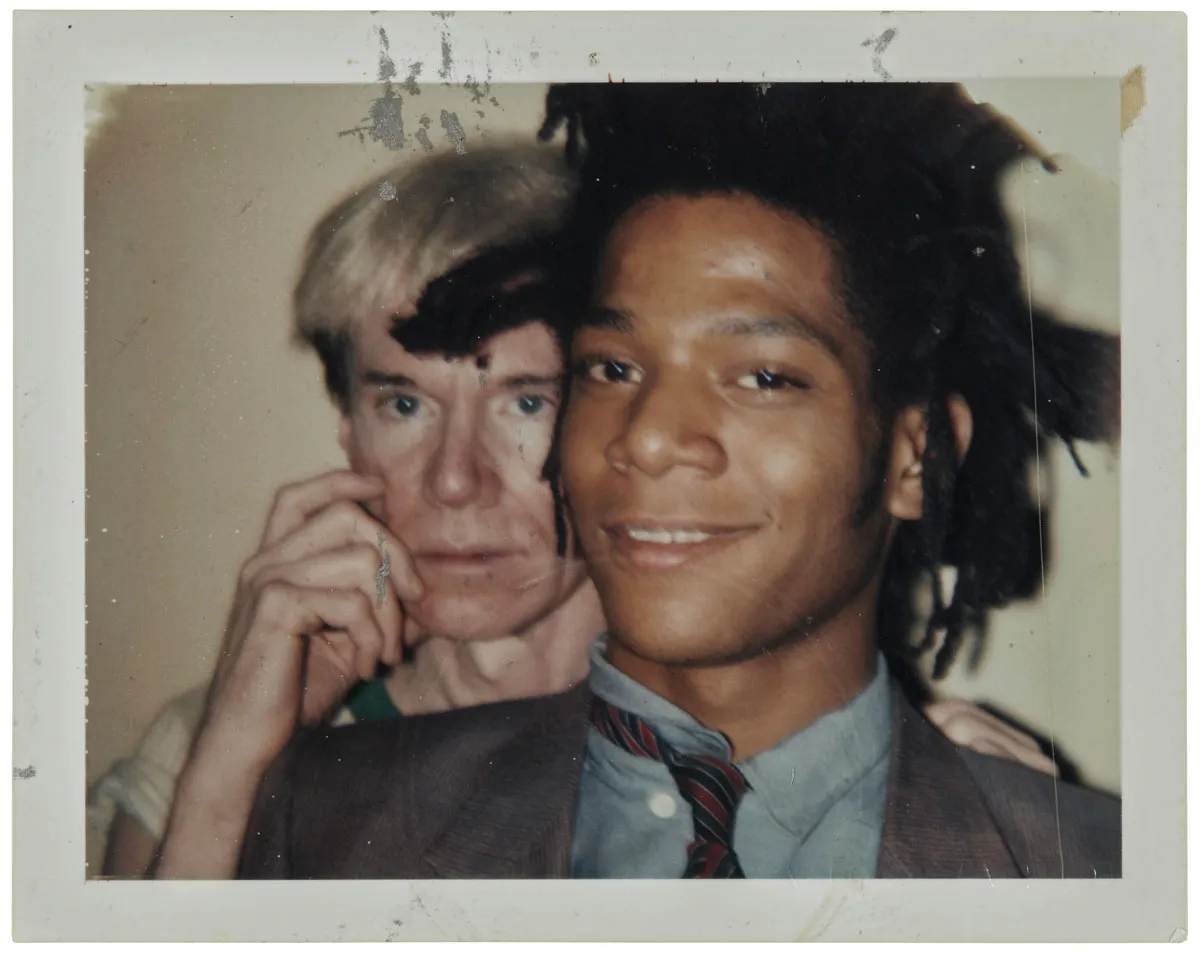 A Polaroid photograph of Andy Warhol and Jean-Michel Basquiat.