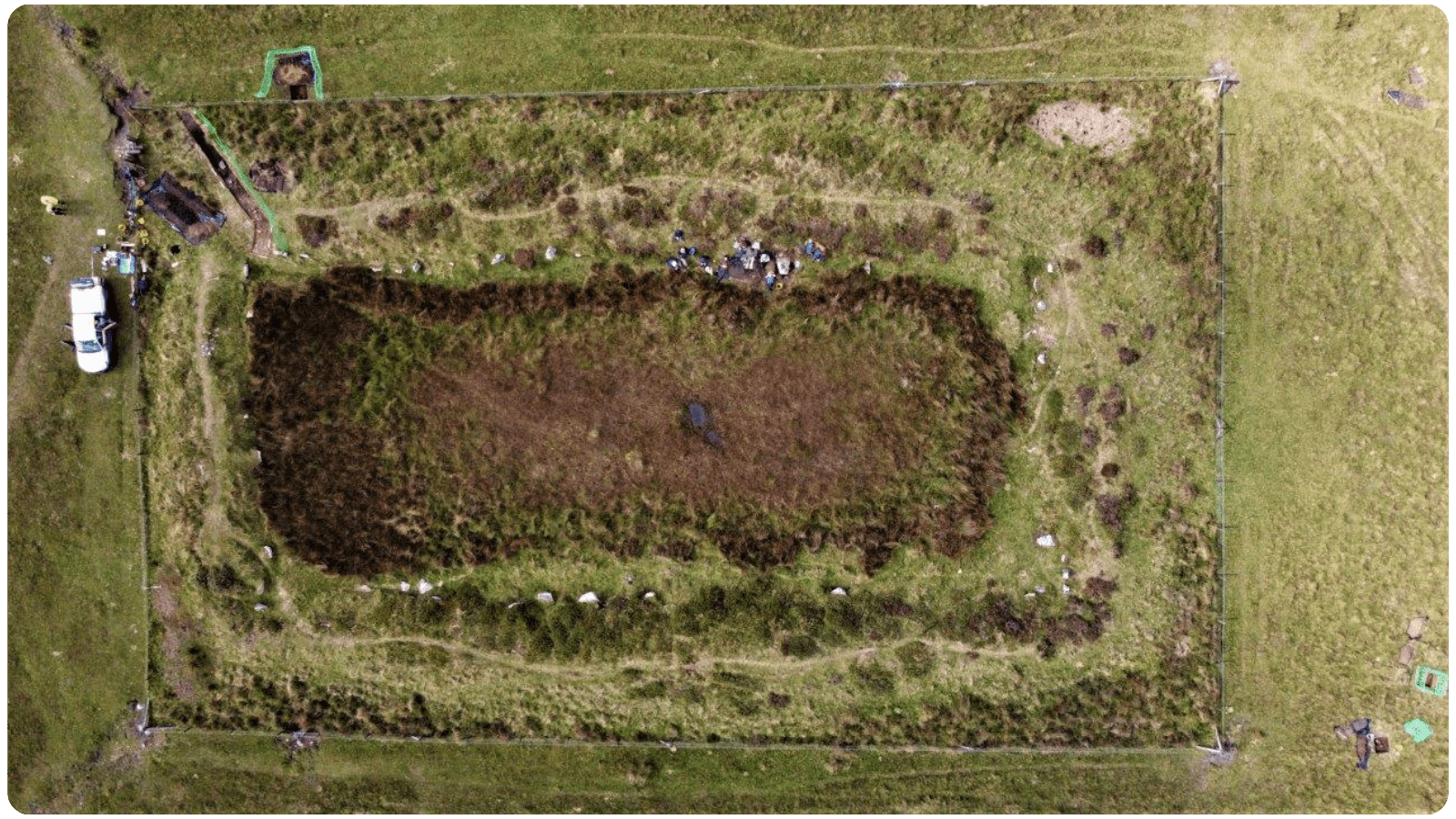 An aerial image of a grassy structure.