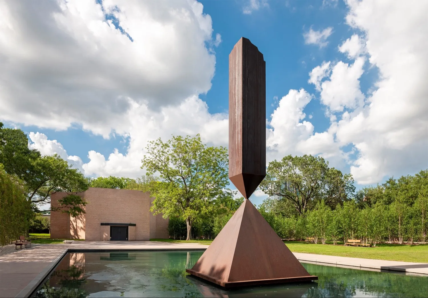 The exterior of the Rothko Chapel is pictured behind the sculpture 